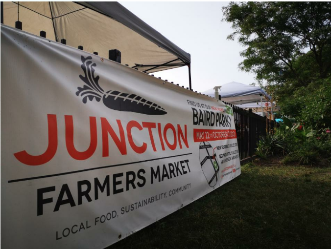 A banner with the Junction Farmer Market.